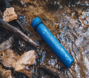 A water filtration survival straw, lightweight and portable, designed for filtering and purifying drinking water in outdoor and emergency situations