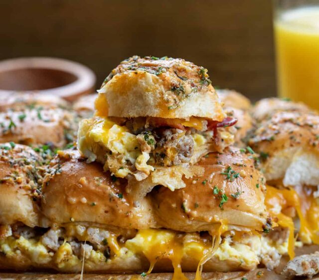 Cowboy Breakfast Sliders with sausage, bacon, egg, and cheddar on King's Hawaiian rolls